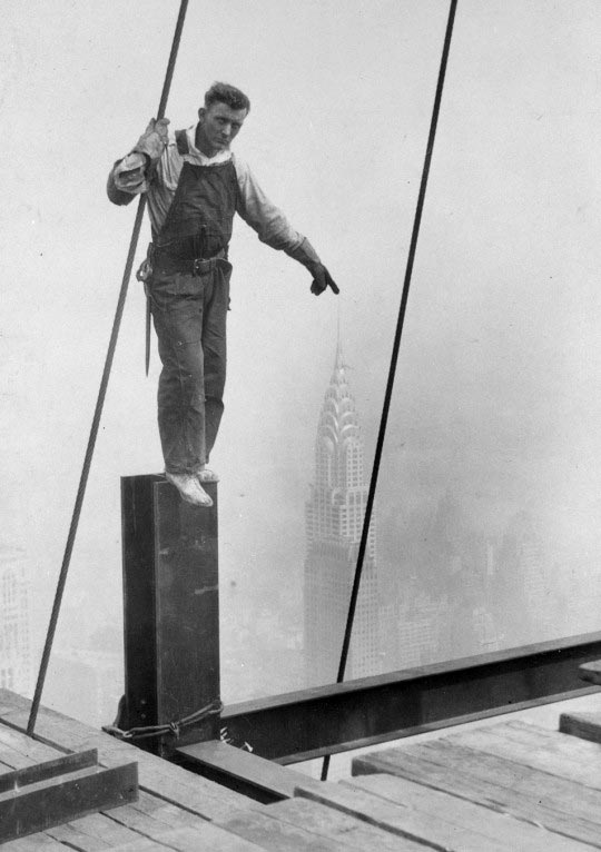 Lewis Hine, Empire State Building Construction Worker Touching The Top Of The Chrysler Building, 1930 ©