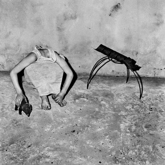 Roger Ballen, head inside shirt